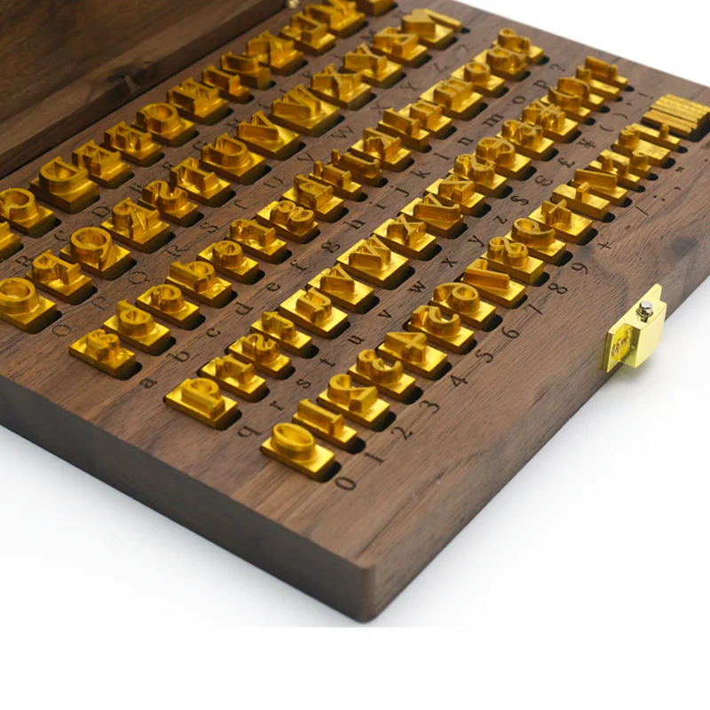ZHENGFEI Precision Brass Hot Stamping Letter & Number Set with Wooden Case Full set of WT Brand CNC-engraved brass alphabet and number movable type for hot stamping, arranged neatly in a wooden storage box.