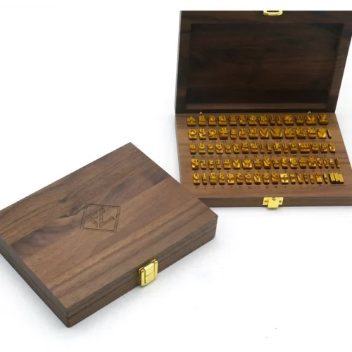 Full set of WT Brand CNC-engraved brass alphabet and number movable type for hot stamping, arranged neatly in a wooden storage box.