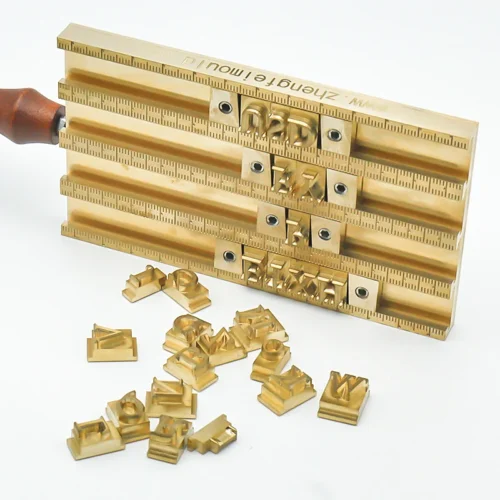 ZHENGFEI Brass Letter Holder Side View with Loose Brass Letters Side view of ZHENGFEI brass letter holder with loose 0.01mm precision engraved brass letters for hot stamping.