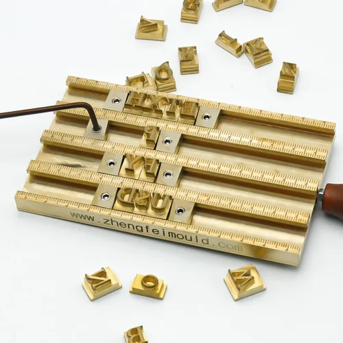 ZHENGFEI Brass Letterpress Type Holder with Precision Scale & Loose Letters ZHENGFEI brass letterpress holder with precision scale for leather hot stamping, 0.01mm CNC engraved brass letters.