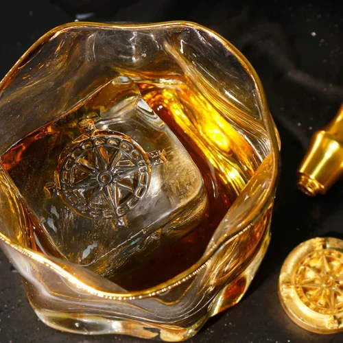 ZHENGFEI compass design ice cube in whiskey glass, made with custom brass ice stamp.