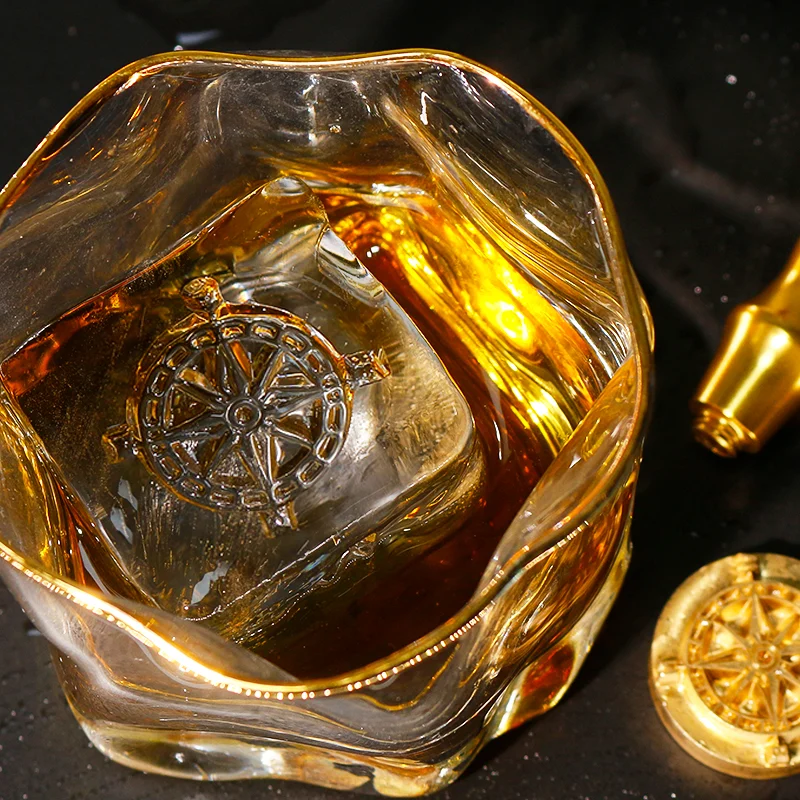 ZHENGFEI compass design ice cube in whiskey glass, made with custom brass ice stamp.