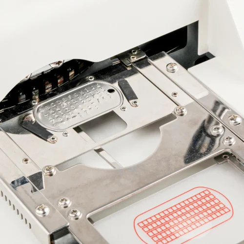 ZHENGFEI Dog Tag Embossing Machine Internal Stamping Station Close-up Close-up of ZHENGFEI dog tag embossing machine internal stainless steel stamping station for precise embossing.