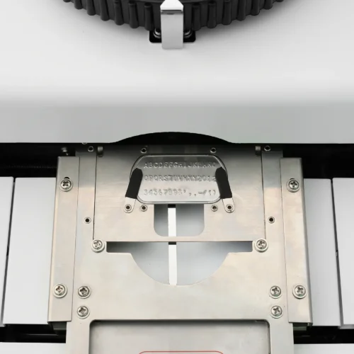 ZHENGFEI Dog Tag Embossing Machine Stamping Guide Plate Front Close-up Front close-up of ZHENGFEI dog tag embossing machine stainless steel stamping guide plate.