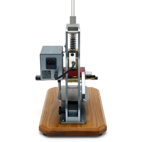 Rear view of ZHENGFEI ELC-01 hot stamping machine with power port, safety switch for commercial workshop use.