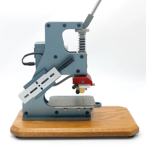Side view of ZHENGFEI ELC-01 hot stamping machine with sliding worktable for flexible leather branding.