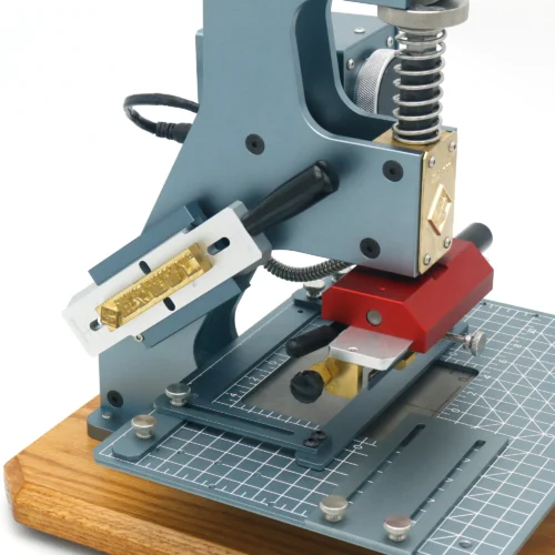 ZHENGFEI ELC-01 hot stamping machine with custom brass mold installed for professional leather branding.