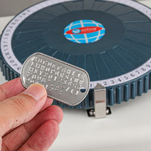 ZHENGFEI Embossed Metal Dog Tag with Character Selection Wheel Display Embossed metal dog tag made by ZHENGFEI manual embossing machine, with full character selection wheel.