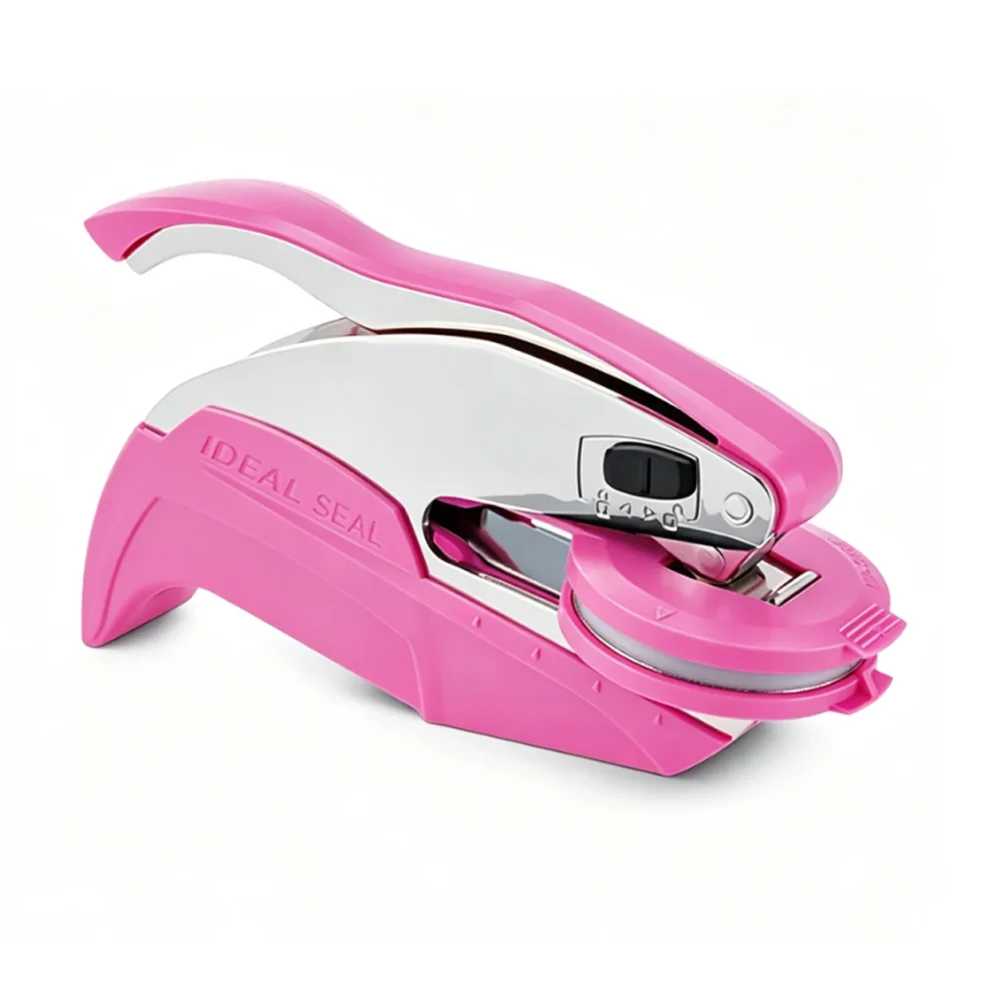 Trodat Pink Hand Embosser Equipped With Circular Steel Seal Die Base Pink Trodat Ideal Seal embosser fitted with round die holder for custom circular laser engraved steel emboss dies.