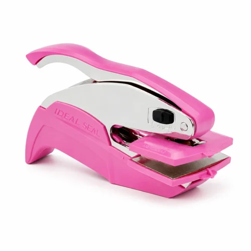 Trodat Ideal Seal Pink Portable Hand Embosser (Without Steel Die) Soft pink Trodat Ideal Seal handheld embosser empty base with polished silver lever on clean white background.