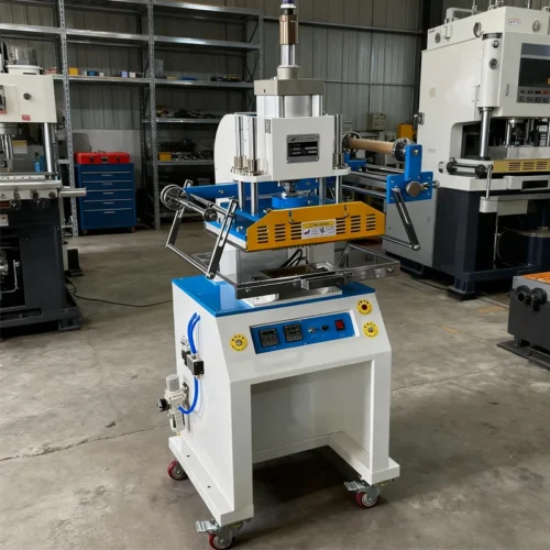 ZHENGFEI 618M pneumatic hot stamping machine displayed in a factory workshop with other industrial equipment.