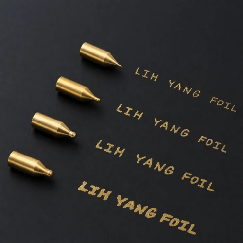 ZHENGFEI Hot Stamping Pen Brass Tips Gold Foil Lettering Sample Four ZHENGFEI CNC brass pen tips with different line width gold foil text printed on black cardstock.