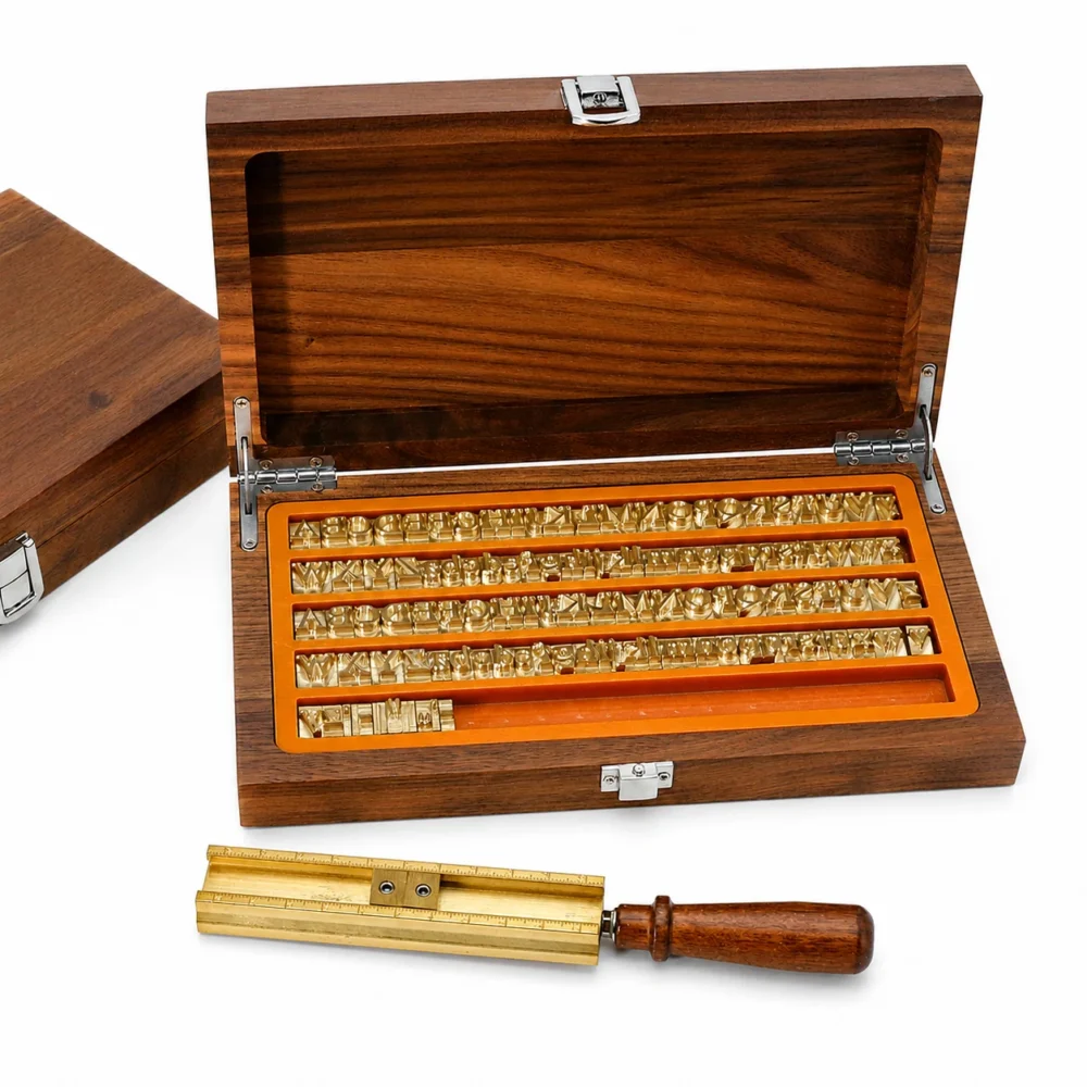 Brass type holder with wooden handle for clamping movable brass letters during hot stamping operations