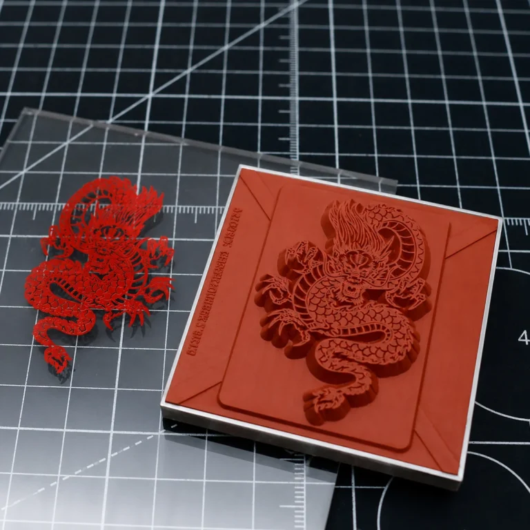 Intricate chinese dragon silicone hot stamping mold and foil‑transferred PMMA acrylic test sample