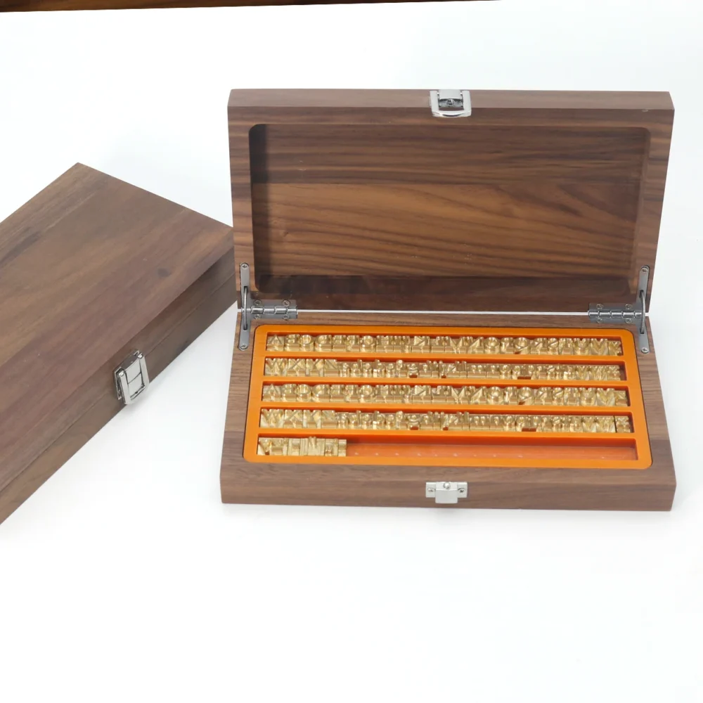 Movable brass letter number set neatly stored inside premium organized walnut wooden box
