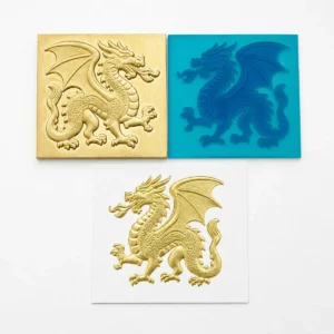 Custom 3D dragon relief brass hot stamping die paired with silicone counter‑die, finished gold foil embossed sample for premium packaging