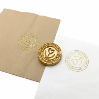 110°C EC‑27 paper napkin foil stamping test with clean full gold foil transfer and sharp circular logo details