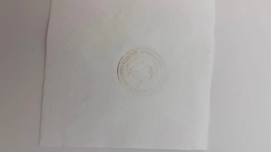 90°C paper napkin foil stamping test with weak transfer and faint imprint, incomplete foil activation