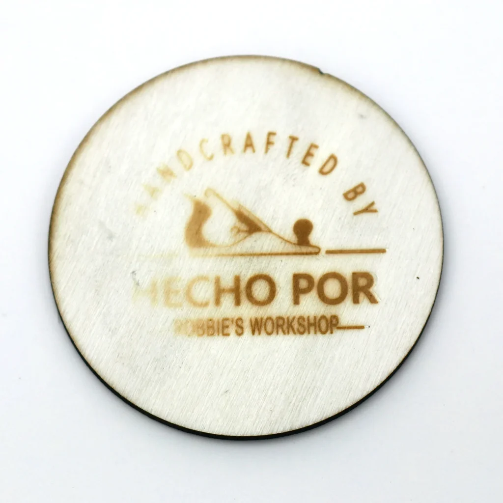 WT-90DS branding test at 200°C shows a pale, incomplete logo mark on thin wood