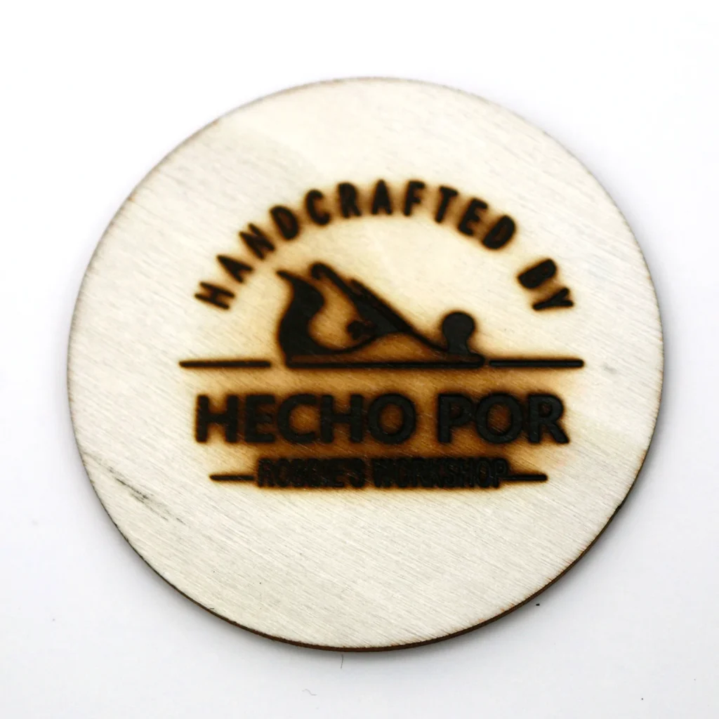 WT-90DS branding test at 350°C shows a heavily charred logo mark on thin wood