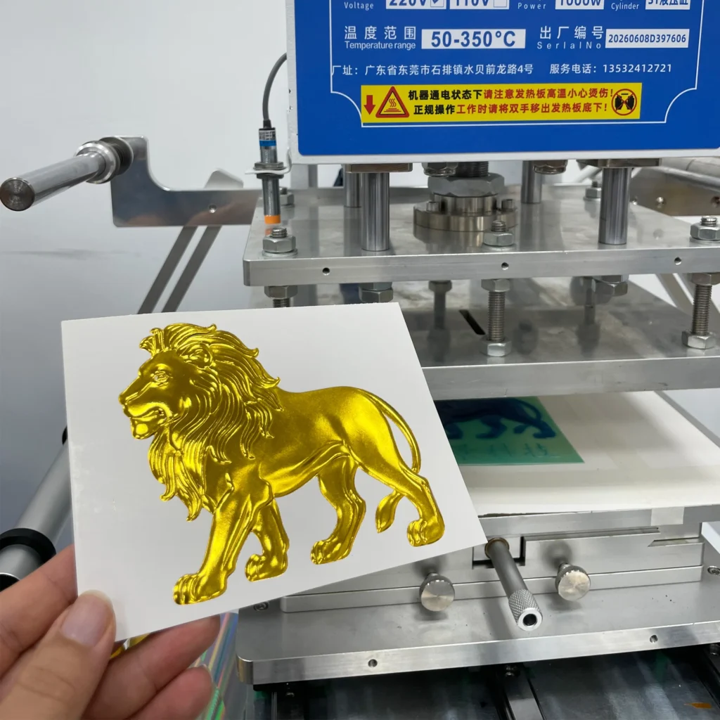 WT-QY300 3-ton hot foil stamping machine golden lion relief foil sample on glossy cardstock at 140°C