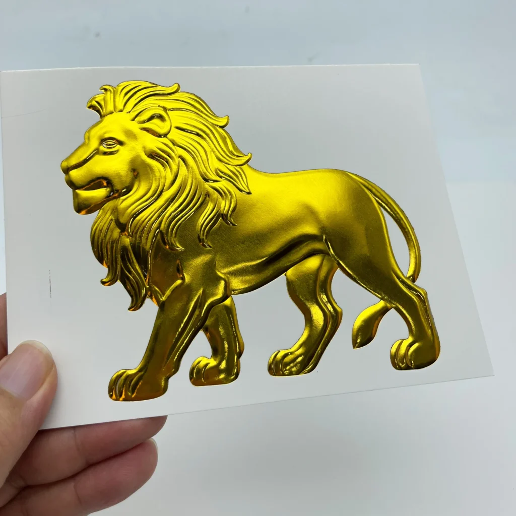 WT-QY300 hot stamping machine gold lion relief foil sample on glossy cardstock, optimal 140°C complete foil transfer